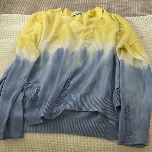 The dye distressed sweater